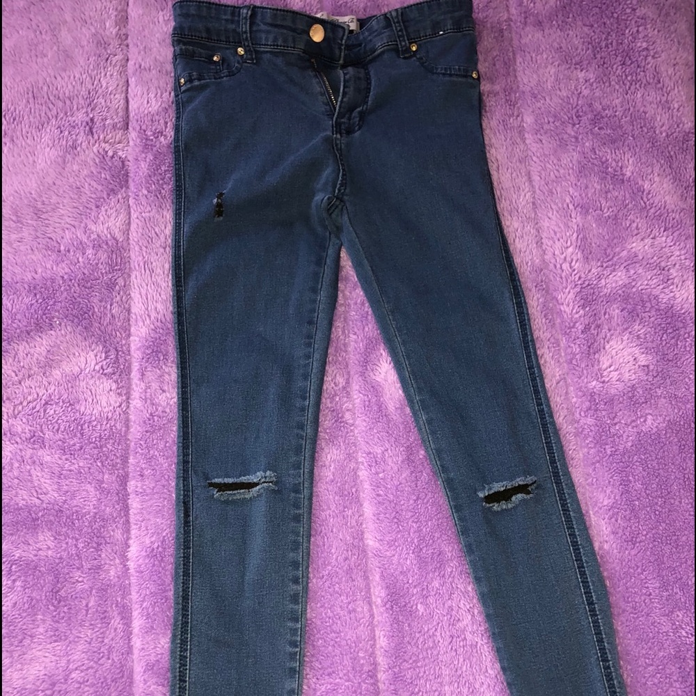 Dark blue distressed denim jeans